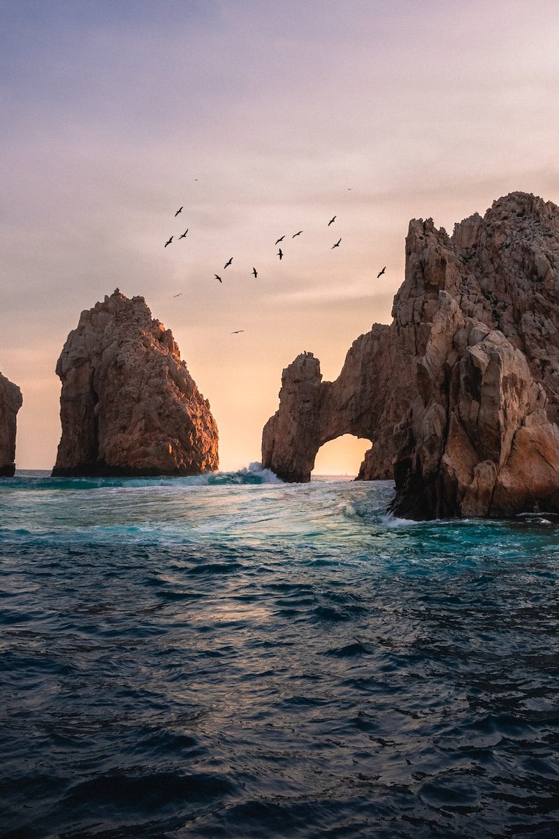 rock formation on the ocean photography